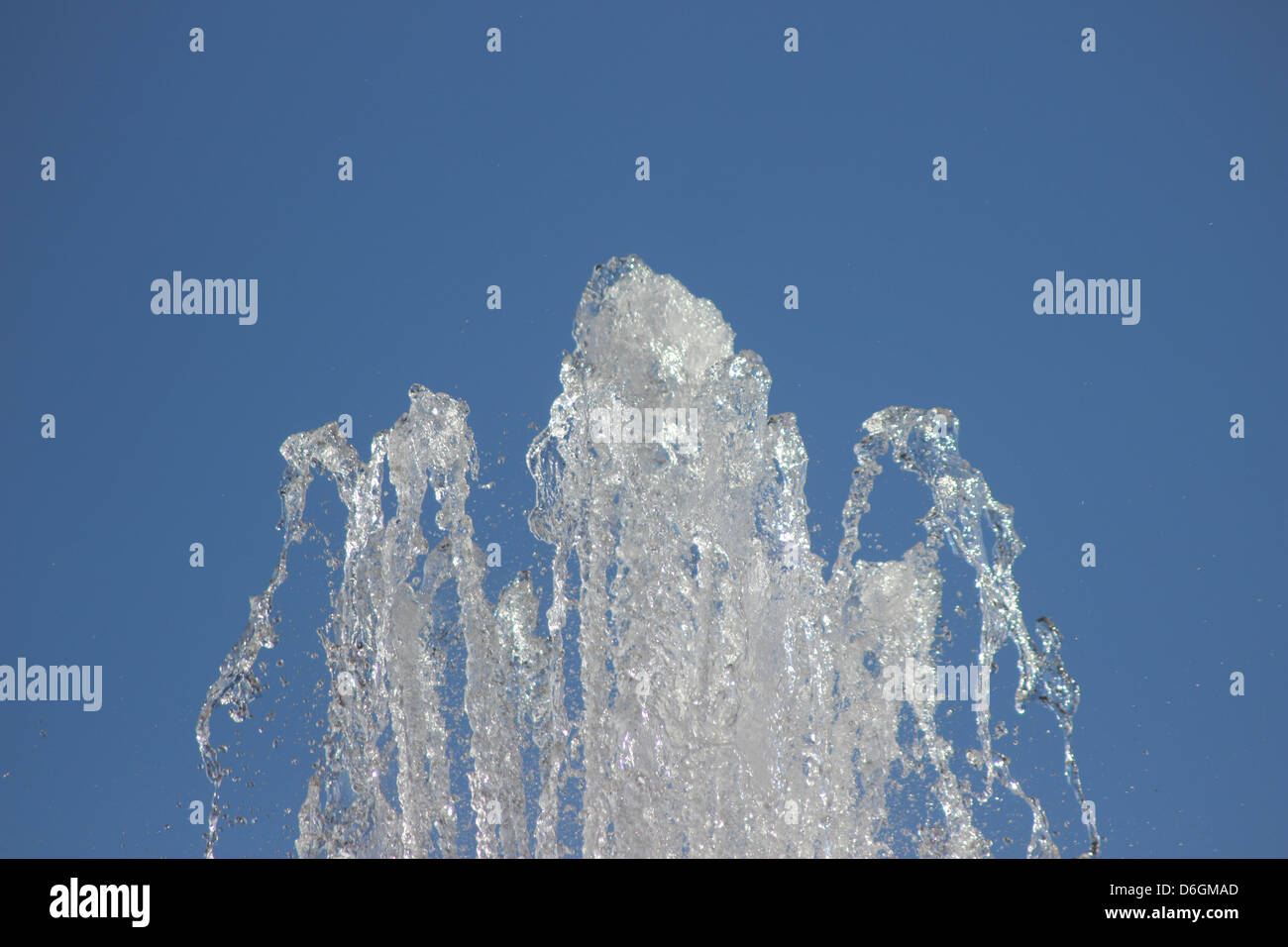 fountain water jet with blue sky Stock Photo