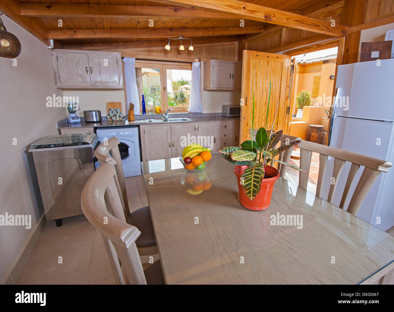 Picture of Kitchen in a luxury apartment showing interior design and dining table ...
