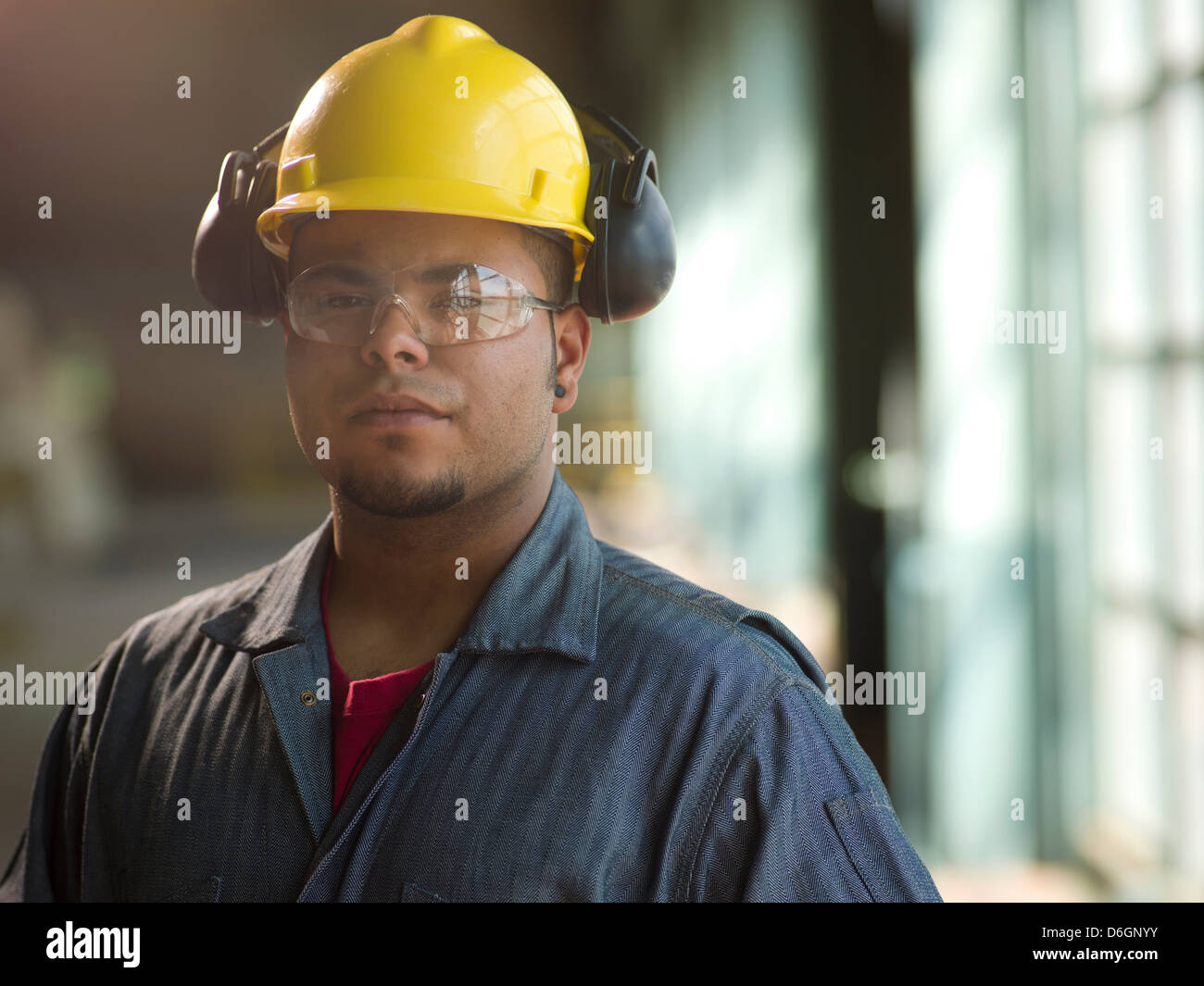 Engineer wearing hard hat on site Stock Photo Alamy