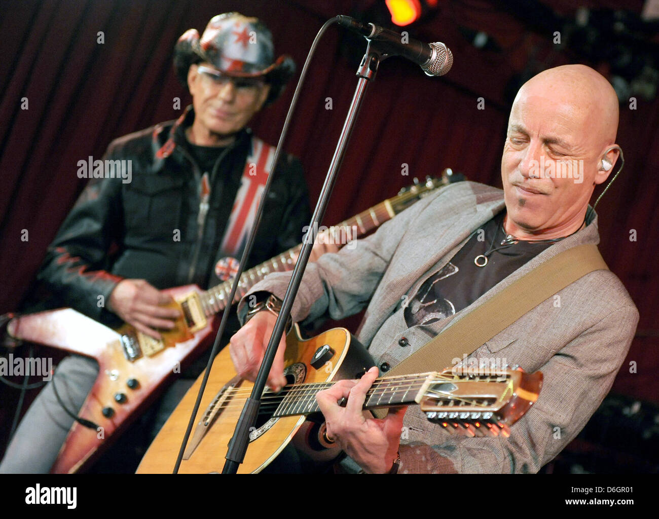 Guitarist Fritz Puppel (L) and singer Toni Krahl from the band City perform in the Red Salon at the Volksbuehne in Berlin, Germany, 22 February 2012. The group is celebrating the 40th anniversary of their formation. The new album "Fuer immer jung" comes out on 24 February 2012. Photo: Britta Pedersen Stock Photo