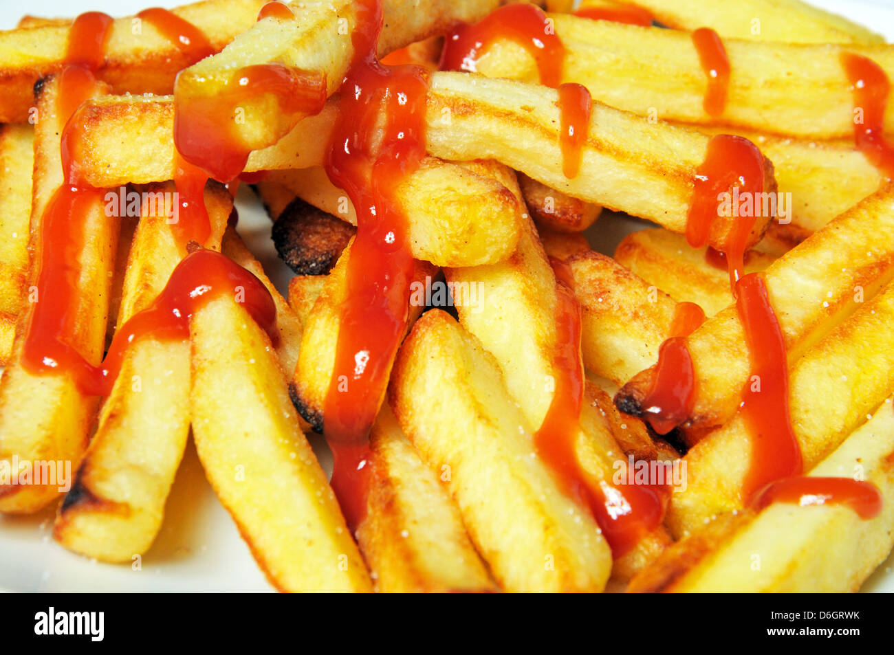 Chips (French fries) with tomato ketchup Stock Photo Alamy