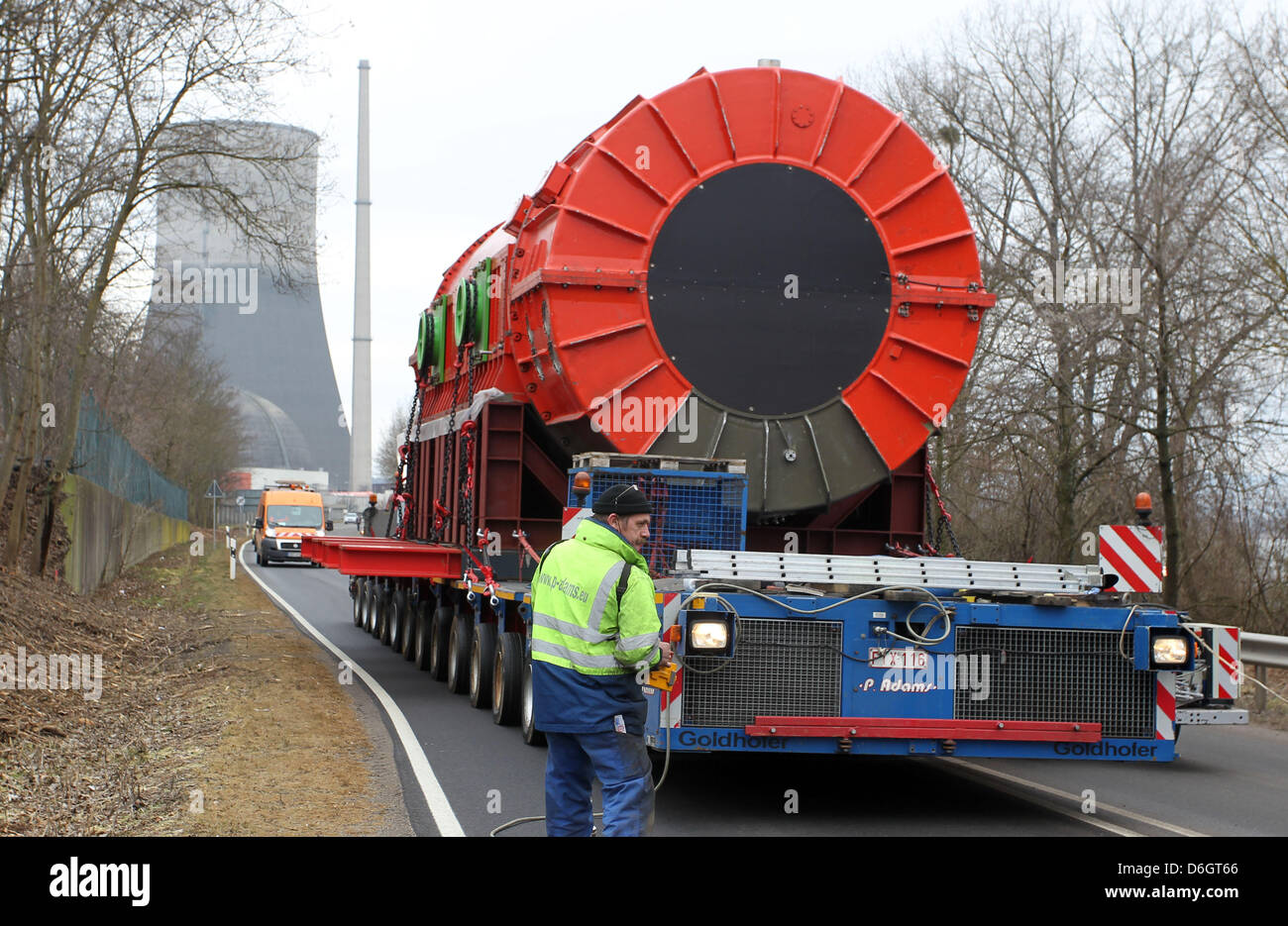 A heavy haulage truck takes away the stator of a generator of the