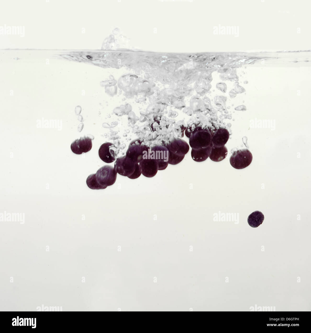 Blueberries splashing into water Stock Photo Alamy