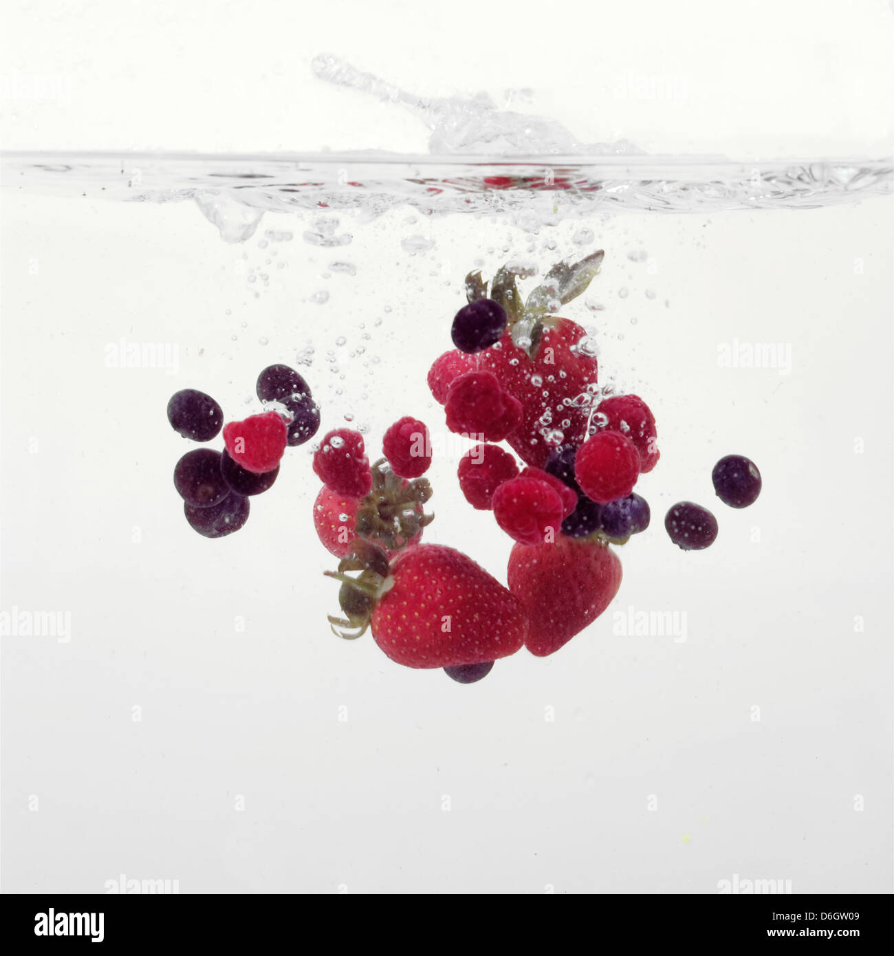 Strawberries and Blueberries splashing into water Stock Photo Alamy