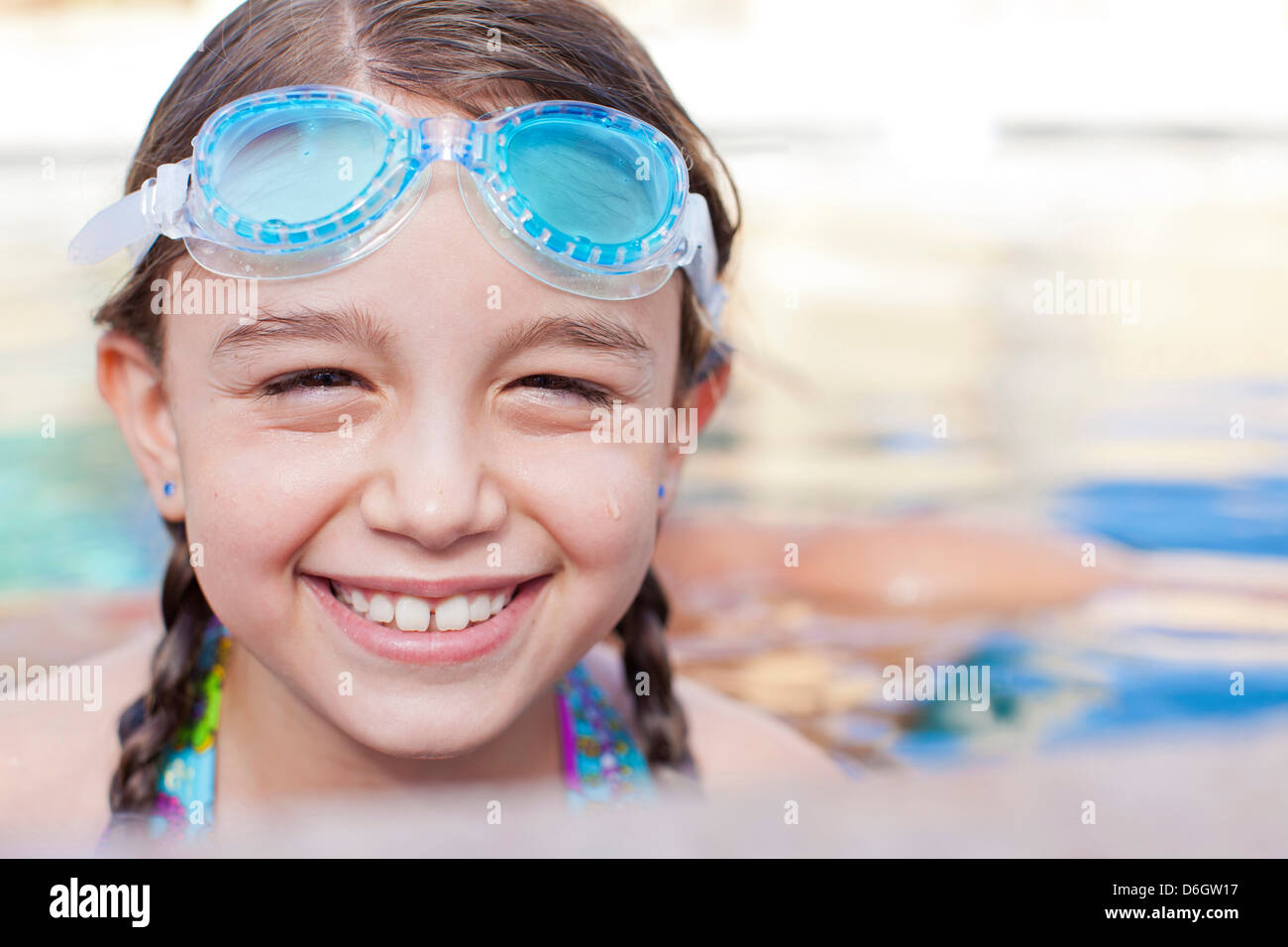 Close up of girl wearing goggles in pool Stock Photo Alamy