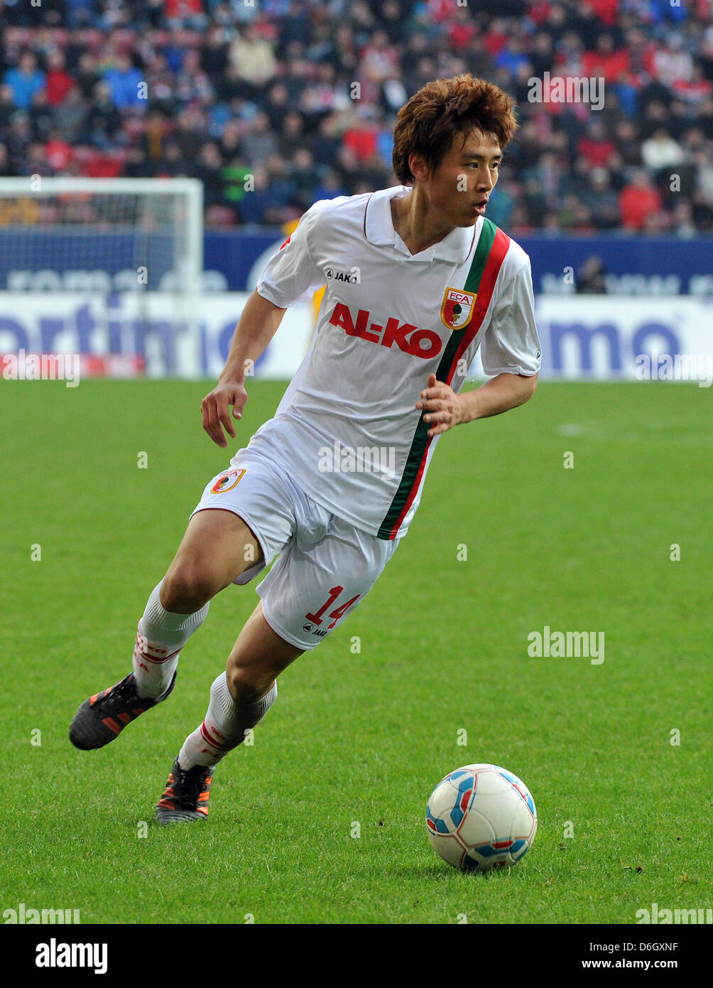Augsburg's Ja-Cheol Koo in action with the ball during the Bundesliga soccer match between FC Augsburg and Hertha BSC at the SGL-Arena in Augsburg, Germany, 25 February 2012.  Augsburg won the match 3-0. Photo: Stefan Puchner Stock Photo