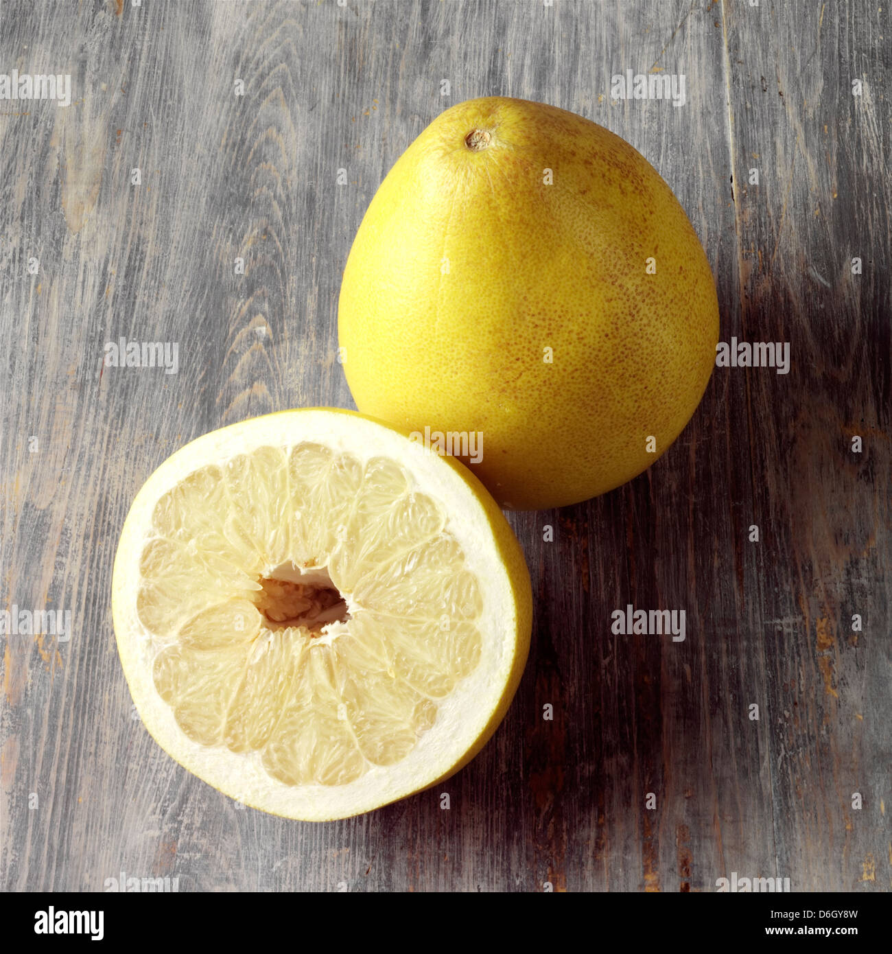 A whole and half Pomelo Stock Photo Alamy
