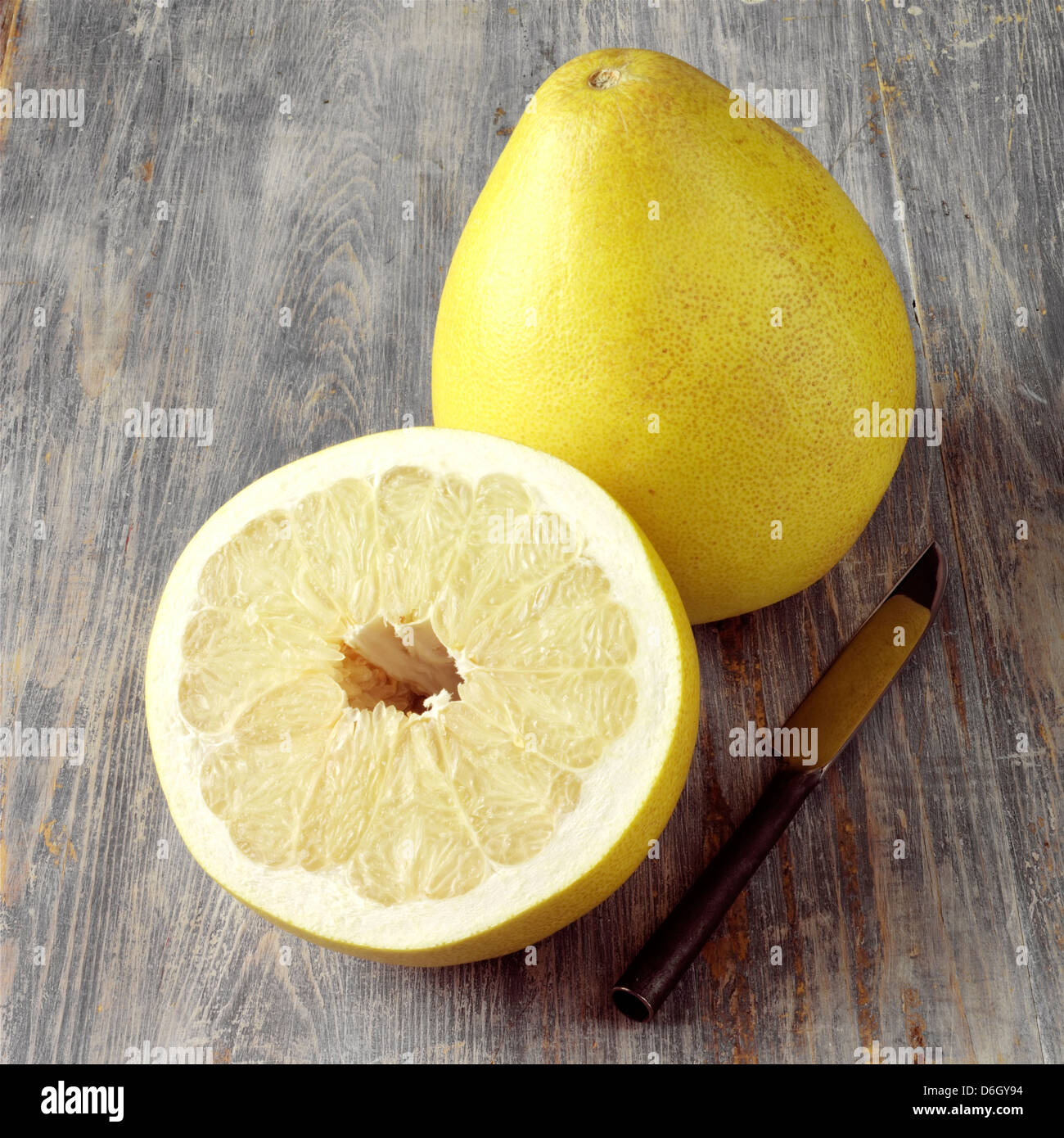 A whole and half Pomelo Stock Photo Alamy
