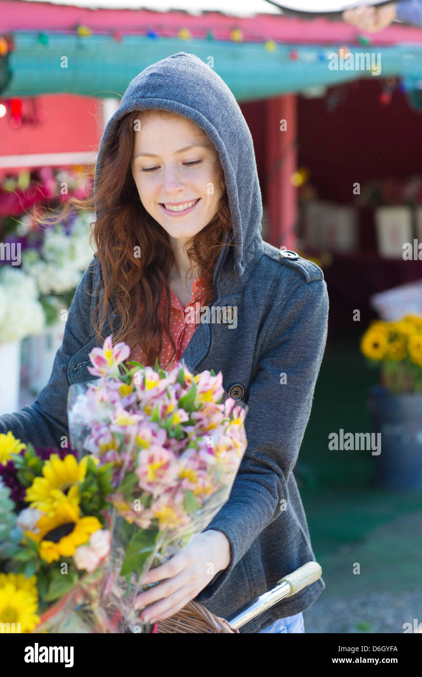 Woman buying flowers at florist Stock Photo