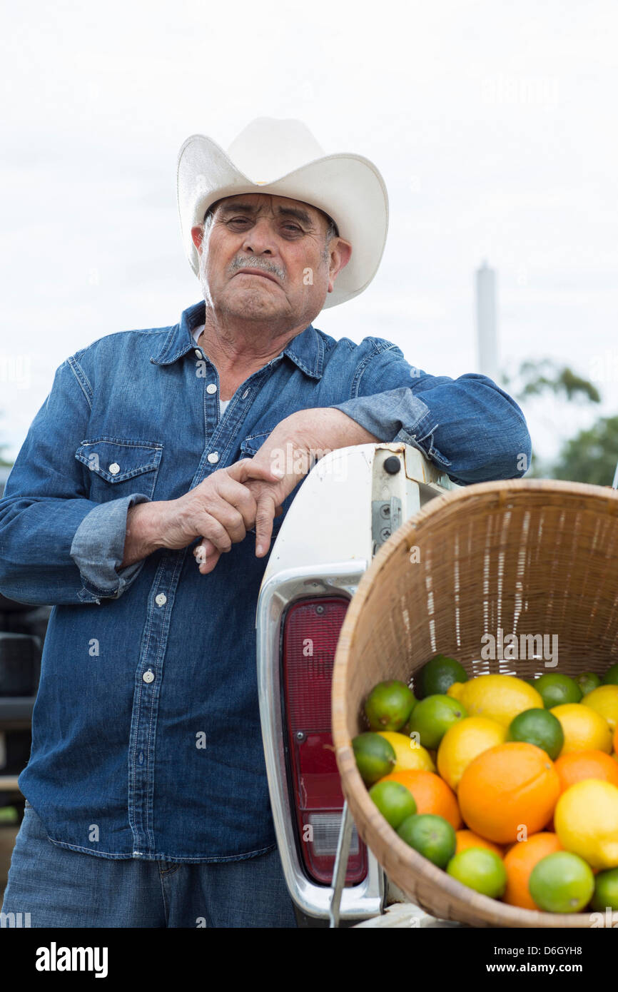 Farmer with produce in truck Stock Photo