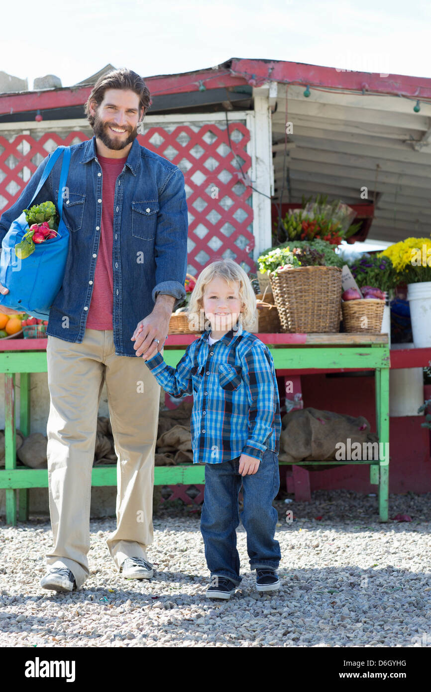 Father and son at farmer?s market Stock Photo