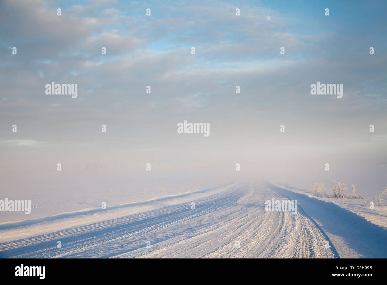 Tire tracks in snowy rural road Stock Photo - Alamy