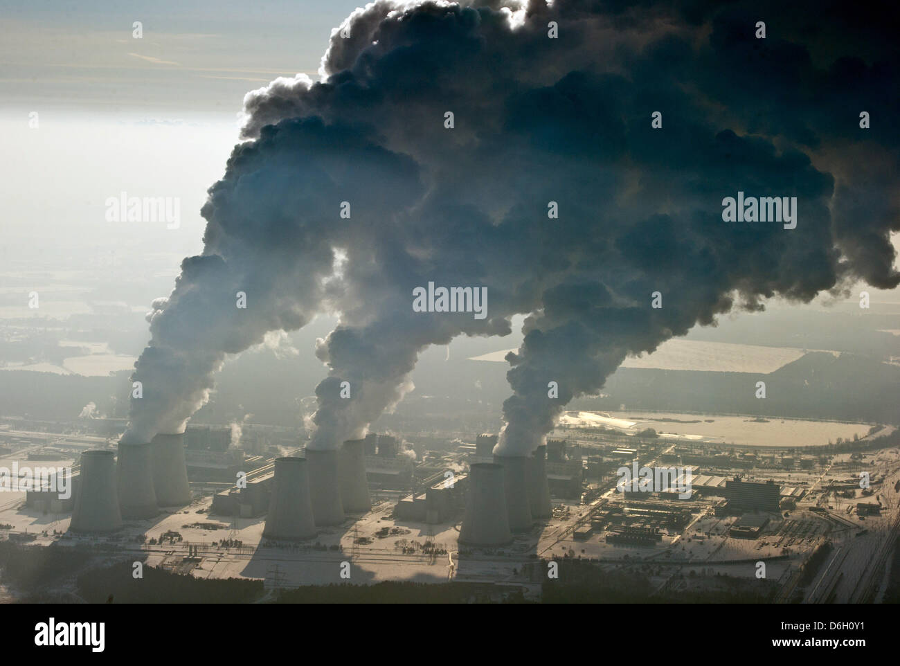 Mighty columns of water vapor rise from the cooling towers of lignite