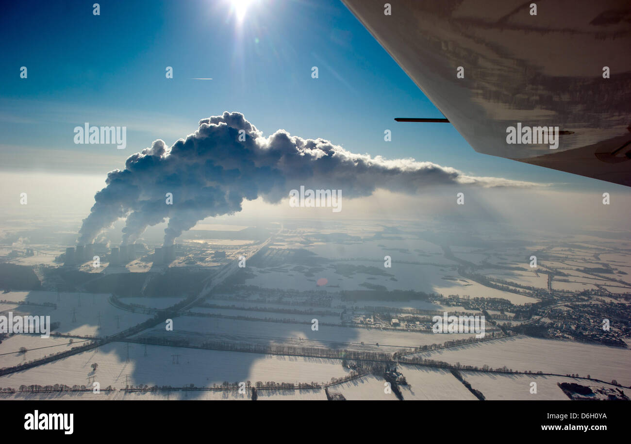 Mighty columns of water vapor rise from the cooling towers of lignite