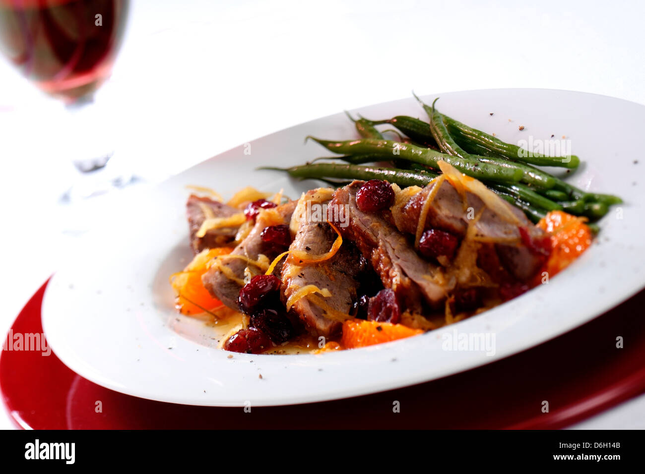 duck with cranberry and orange Stock Photo Alamy