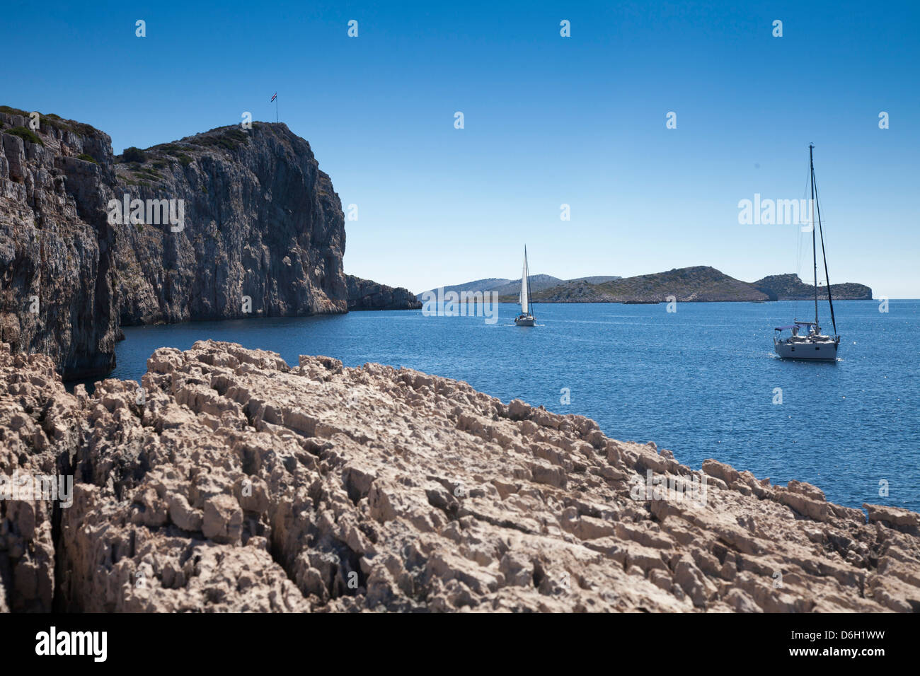 Sailboats on still lake Stock Photo