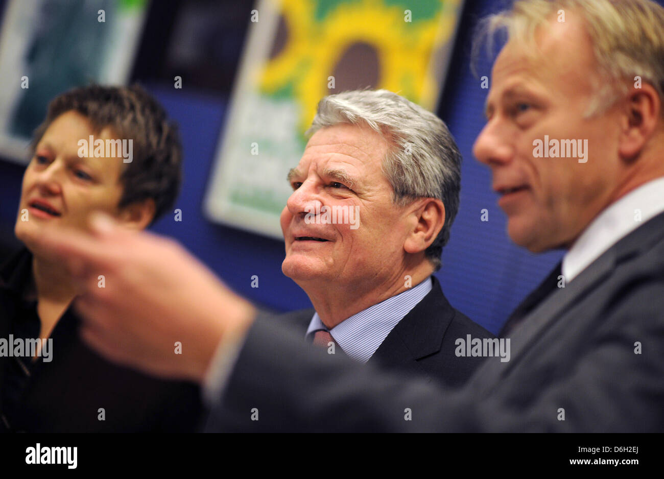Joachim Gauck (C), candidate for the office of German President, talks with the leaders of the Green Party, Renate Kuenast and Juergen Trittin (R), before the start of a meeting of The Greens parliamentary party group in the Reichstag building in Berlin, Germany, 28 February 2012. Gauck, who was nominated as German President by the CDU/CSU, SPD, FDP and Alliance 90/The Greens, is i Stock Photo