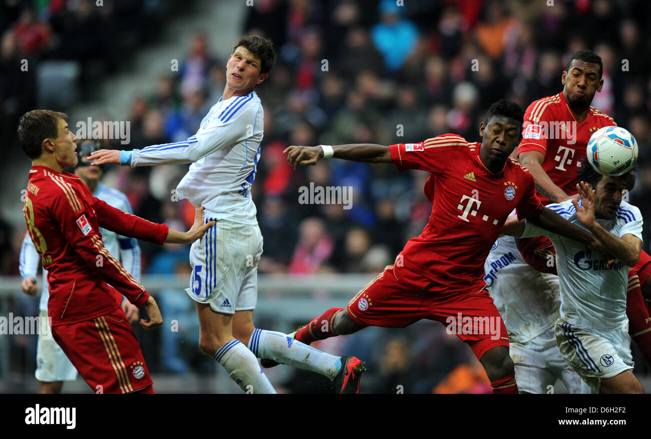 Munich's Jerome Boateng (behind R), David Alaba (3-r) and Holger Badstuber (L) vie for the ball with Schalke's Klaas Jan Huntelaar and Raul (R) during the German Bundesliga match between FC Bayern Munich and FC Schalke at the Allianz Arena in Munich, Germany, 26 February 2012. Photo: Thomas Eisenhuth Stock Photo