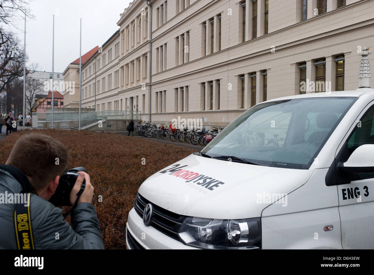 Cars of Danish media representatives stand in front of the Justice center hosting the trial against Dane Peter R. in Potsdam, Germany, 01 March 2012. On the left, the evaluator Cornelia Nikolaiczky and the lawyer of the joint plaitiff Matthias Schoeneburg are seen.  The 40 year old father is accused of double murder allegedly killing his daughters Line-Sofie (9) and Marlene Marie ( Stock Photo