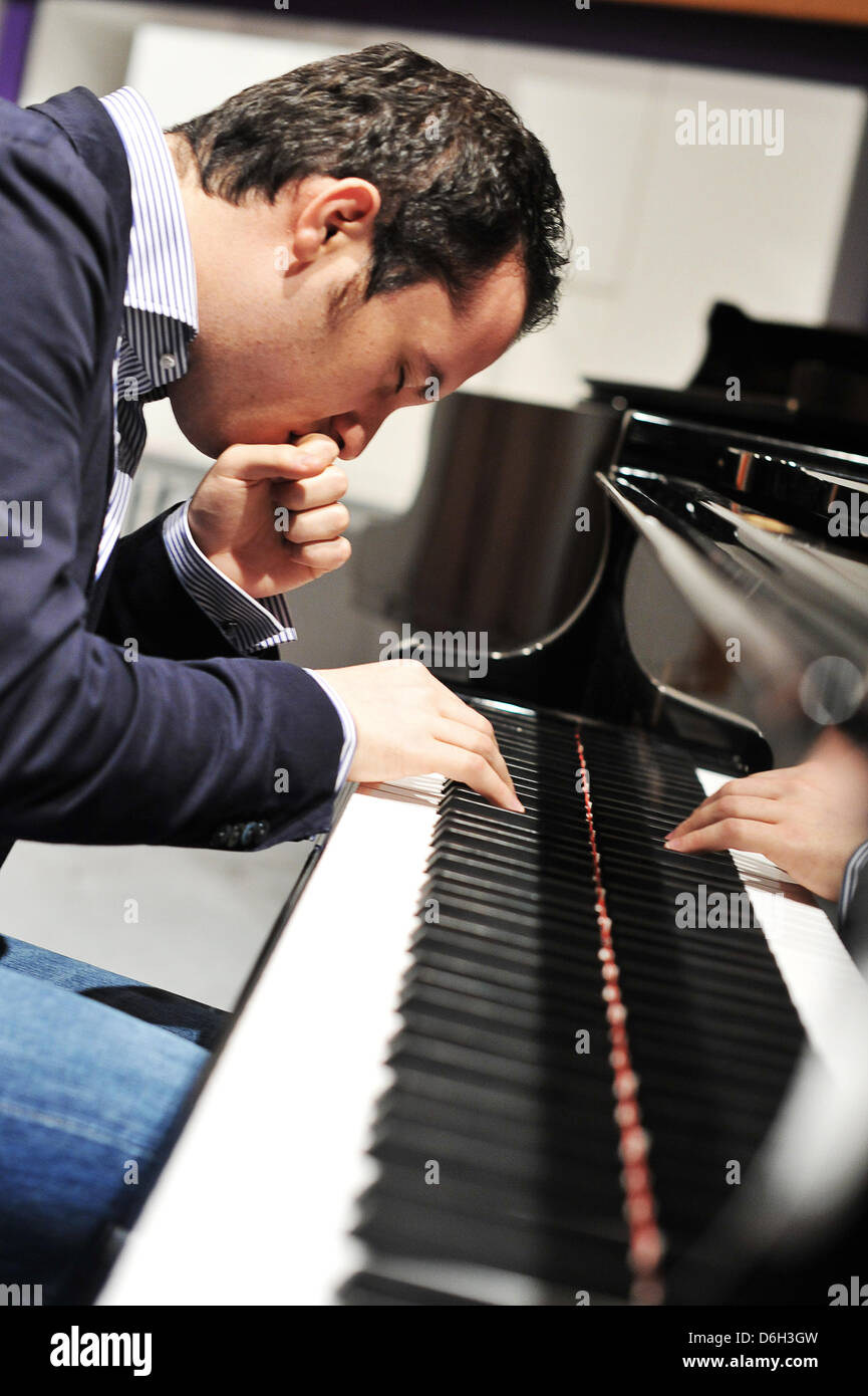 FILE - A file photo dated 23 February 2012 shows Russian-German pianist  Igor Levit playing the piano in Hanover, Germany. Levit has been appointed  BBC New Generation Artist recently. Photo: BARBORA PREKOPOVA