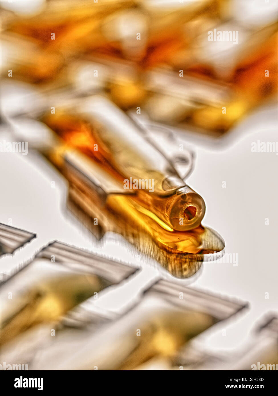 Close up of spilled vial of liquid Stock Photo
