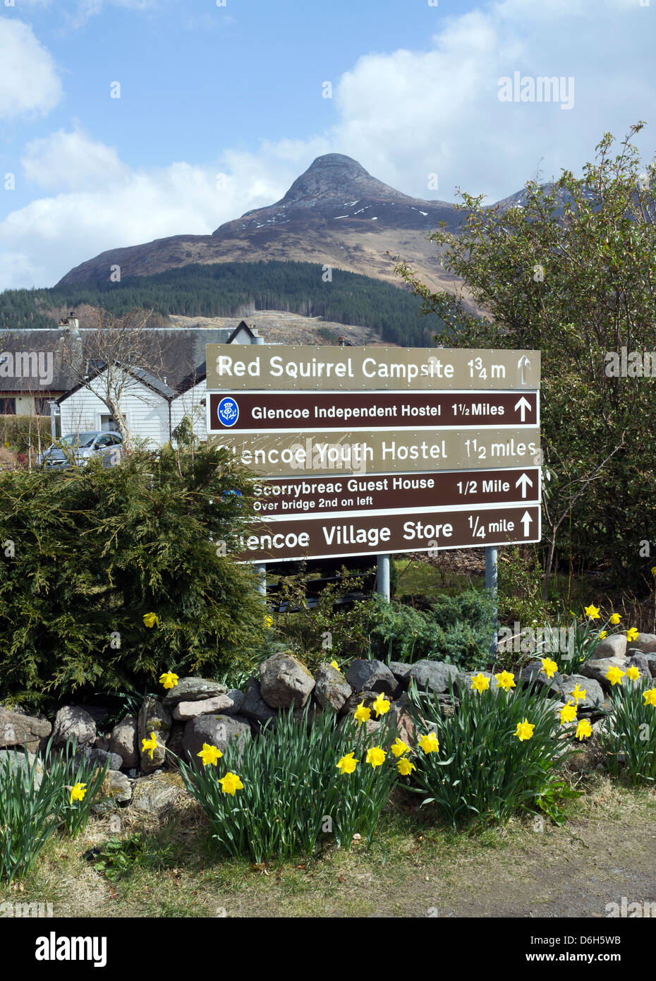 Tourist Information Signs at Glencoe Village with the Paps of Glencoe in the background Highlands Scotland UK Stock Photo