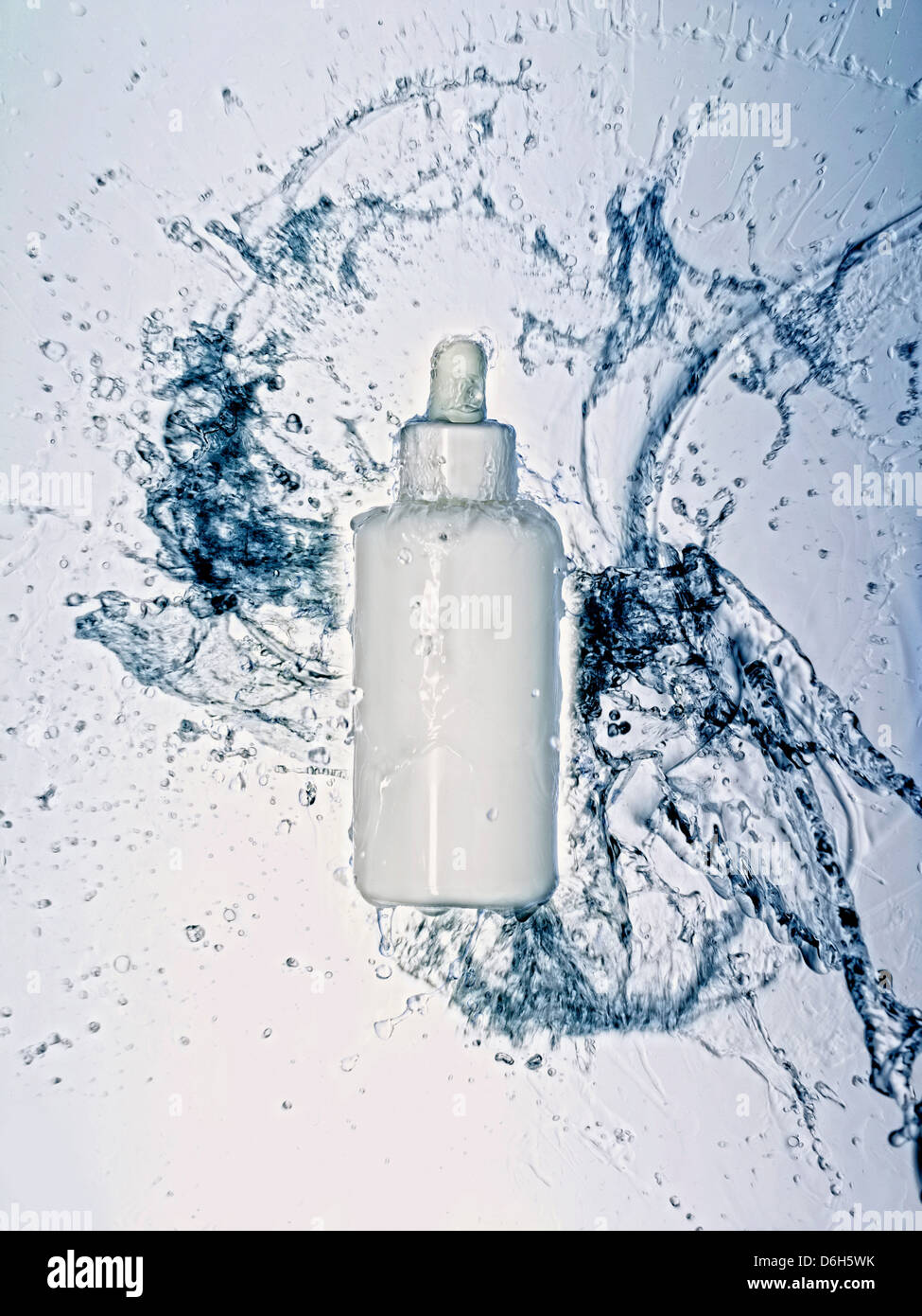 Water splashing on bottle Stock Photo