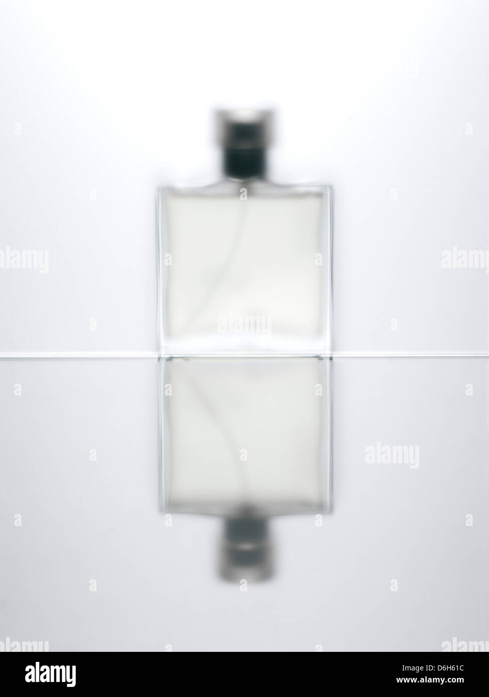 Blurred view of perfume bottle Stock Photo