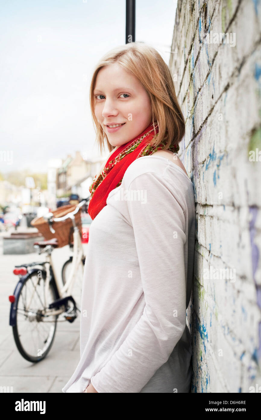 Beautiful woman stands leaning hi-res stock photography and images - Alamy