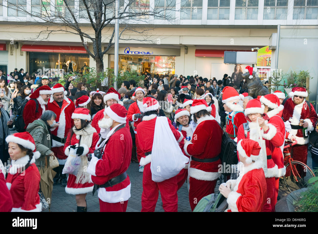 people in Santa costumes at the Hachiko dog meeting point, Shibuya ward