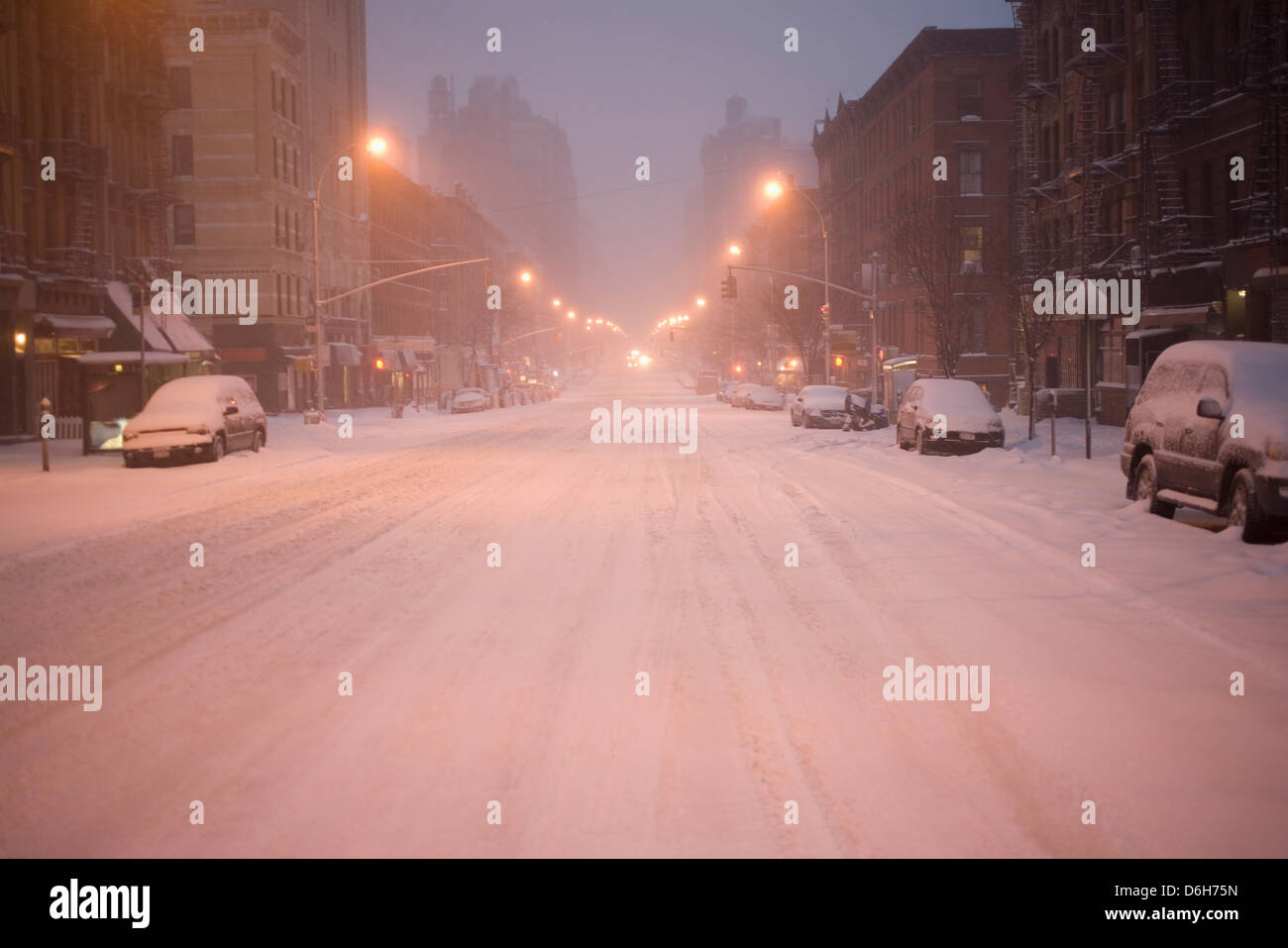 Cars parked on snowy city street Stock Photo - Alamy