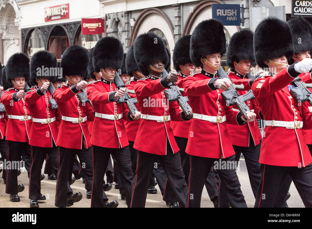 The Queen's Guard marches by, perfectly synchronized as part of the procession for Margaret Thatcher's funeral in London. Stock Photo