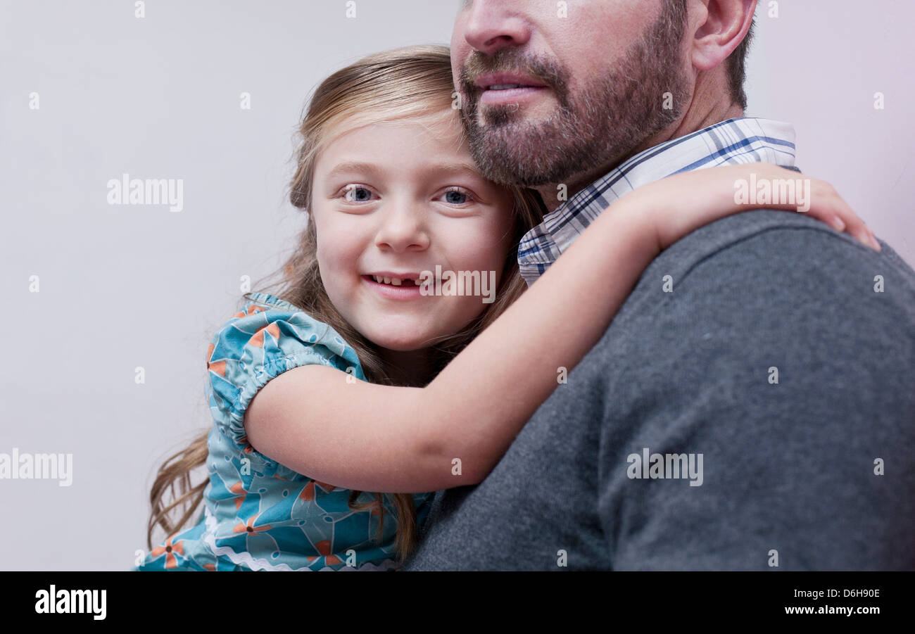 Father holding daughter Stock Photo