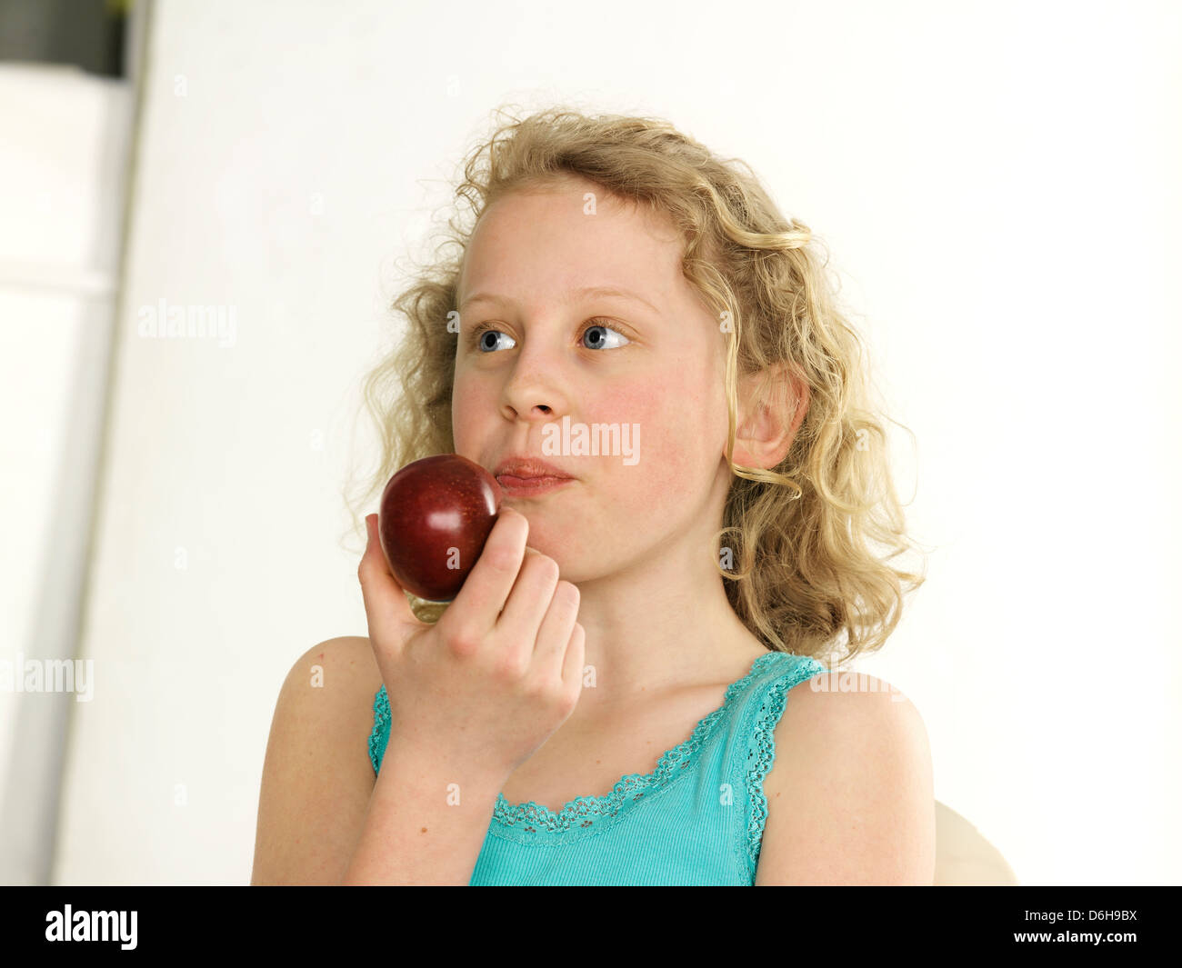 Young girl eating apple Model release all media Stock Photo Alamy