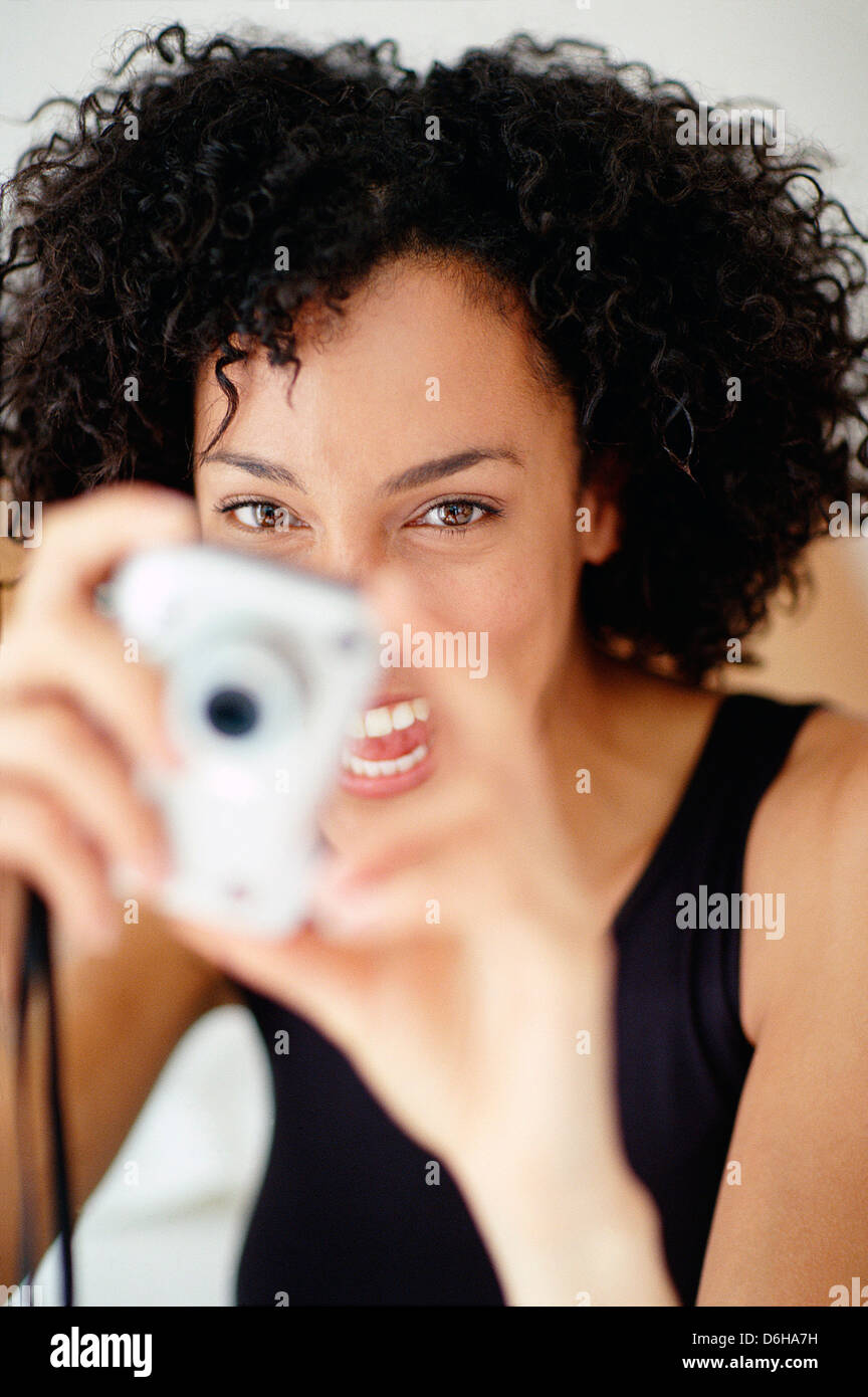 Woman taking a photograph Stock Photo