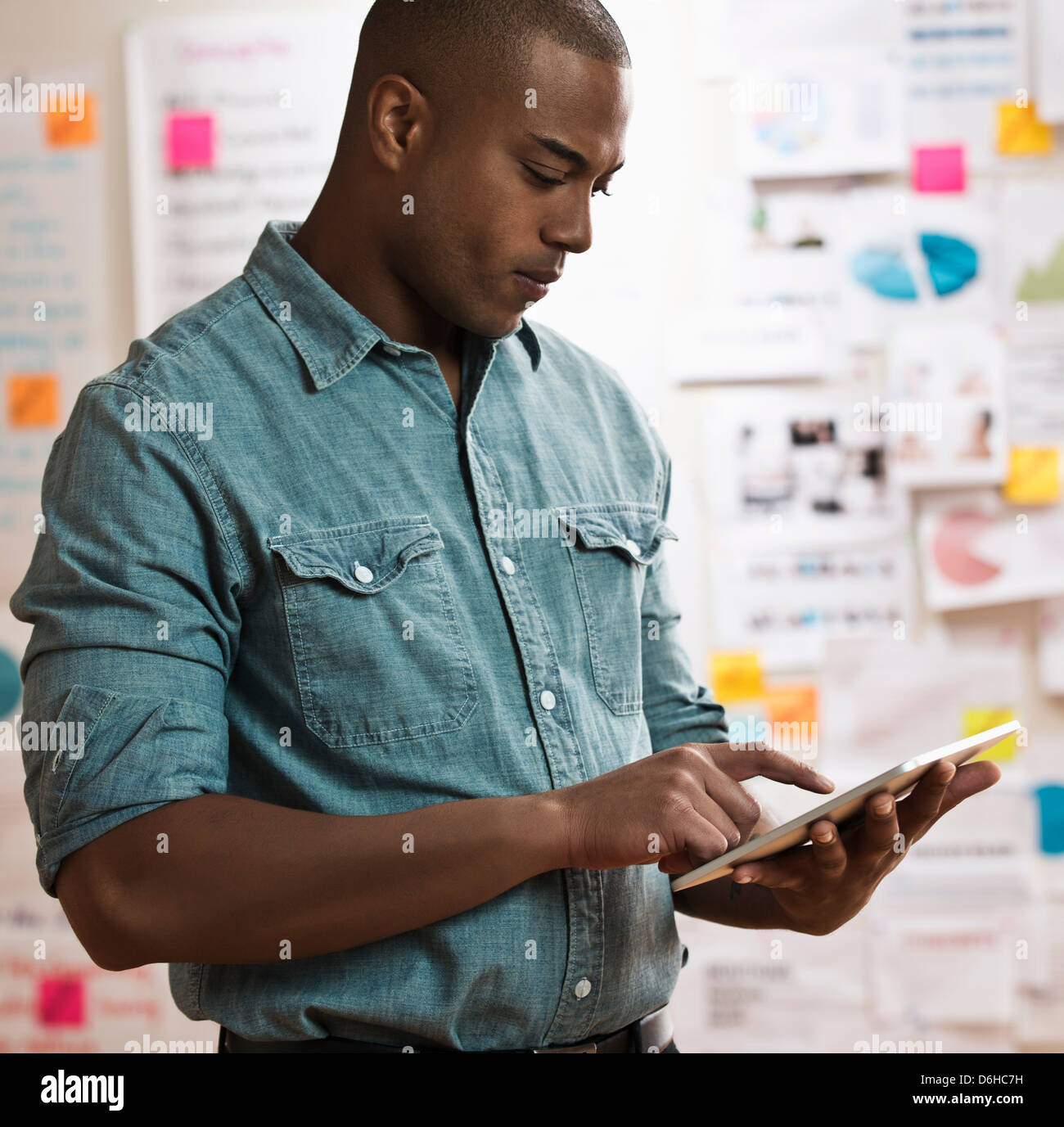 Man using digital tablet Stock Photo - Alamy