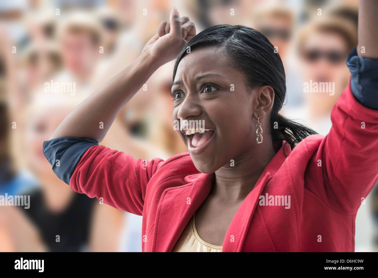 Excited woman in crowd Stock Photo