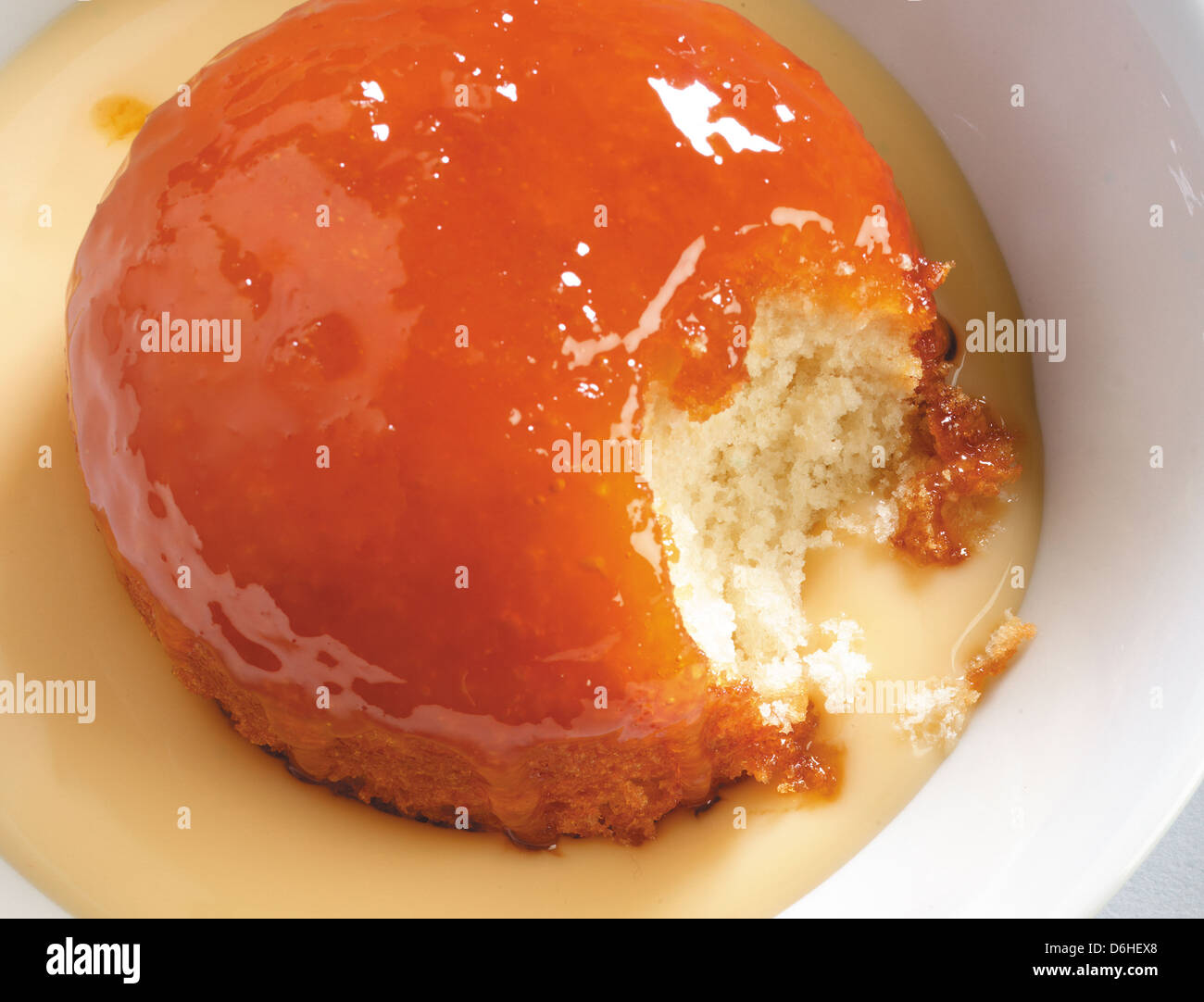 Treacle pudding and custard Stock Photo Alamy