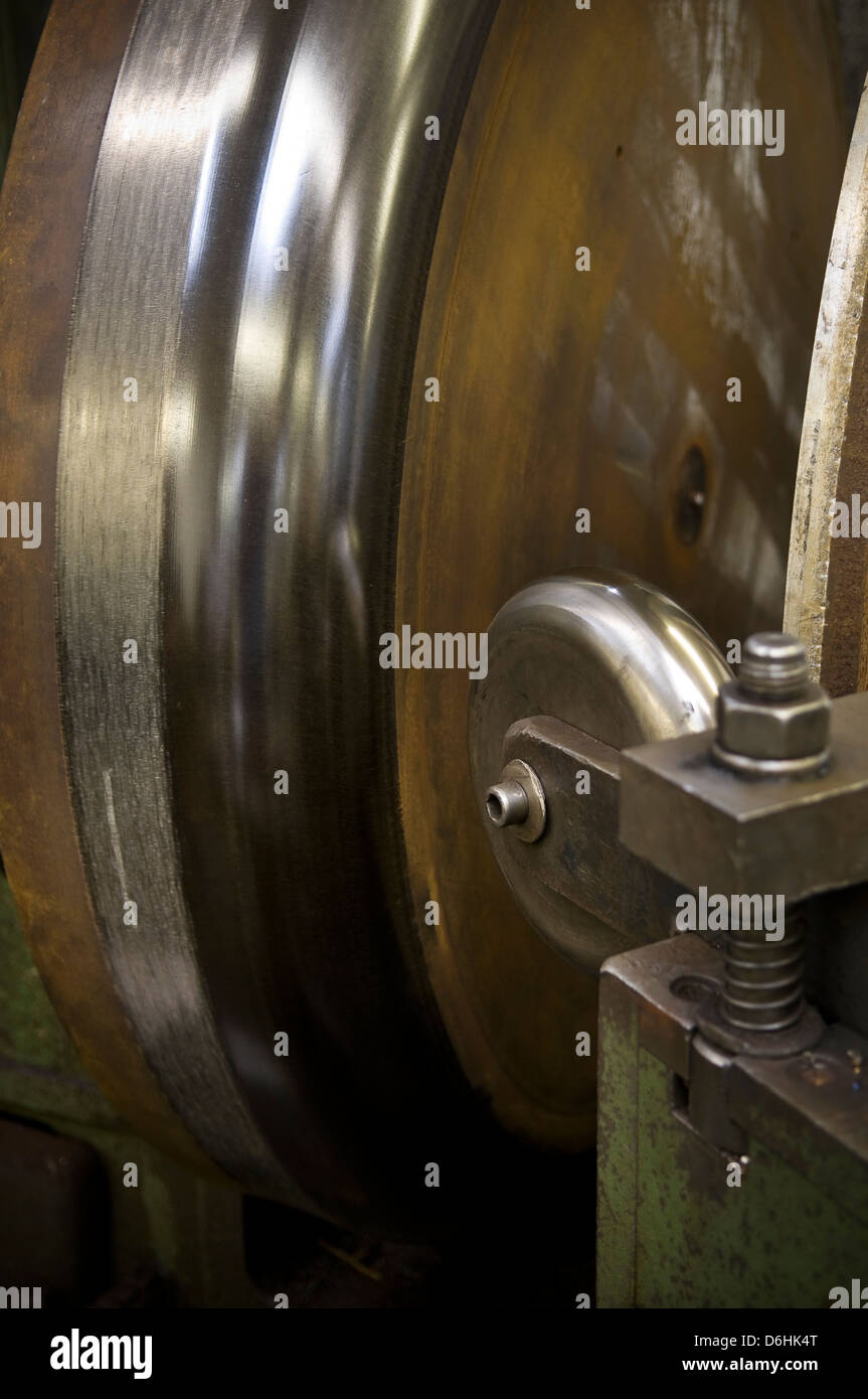 Industrial lathe and former used for metal spinning process Stock Photo