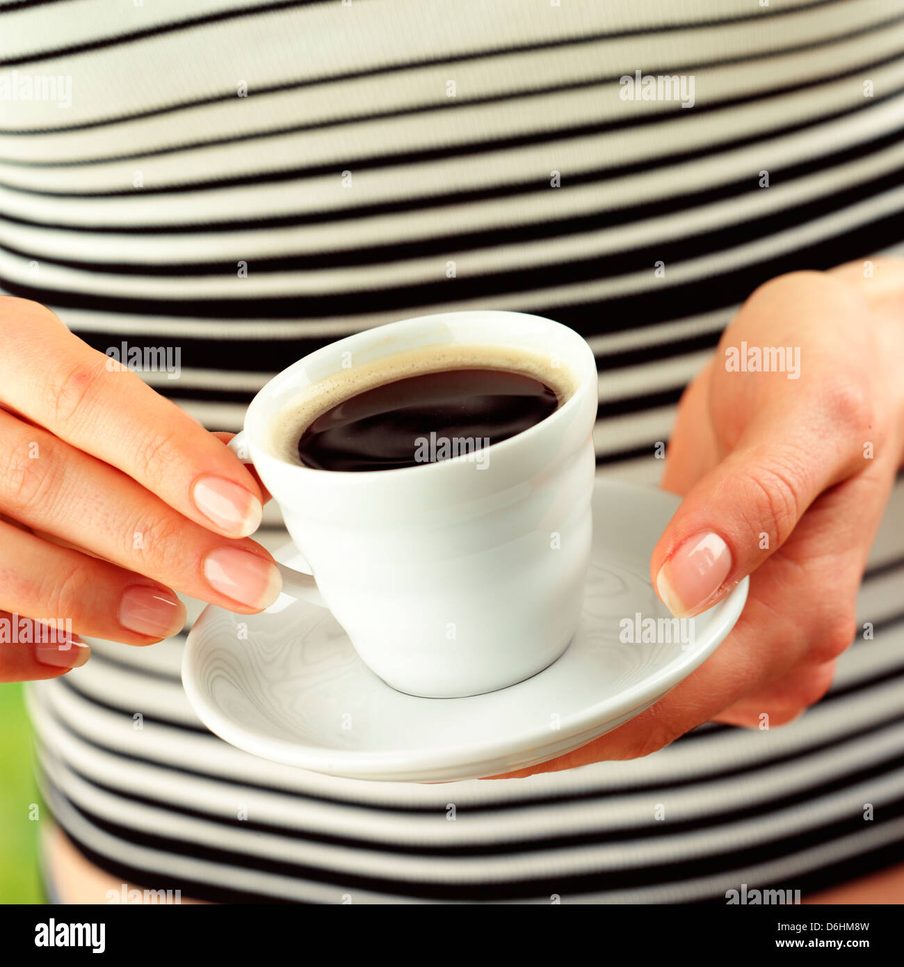 View of Hands holding cup of espresso Stock Photo - Alamy