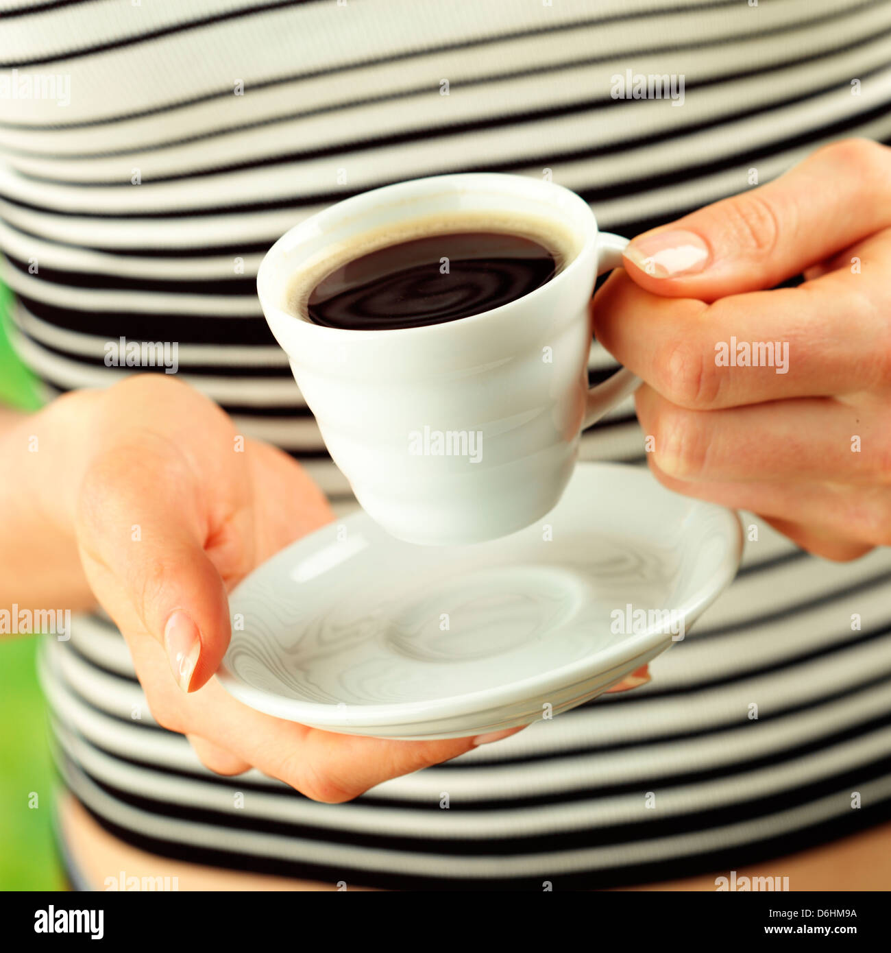 Picture of Hands holding cup of espresso Stock Photo - Alamy
