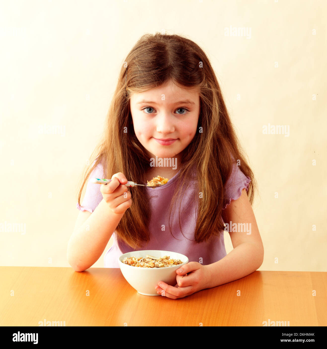 Girl eating muesli Stock Photo Alamy