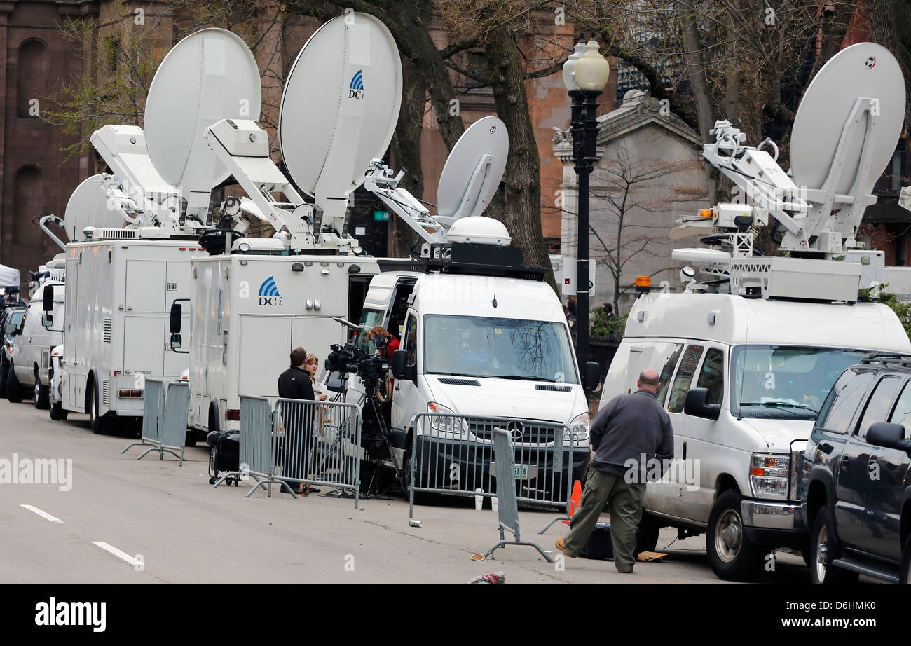 Media satellite trucks parked in Boston following bombing at the finish