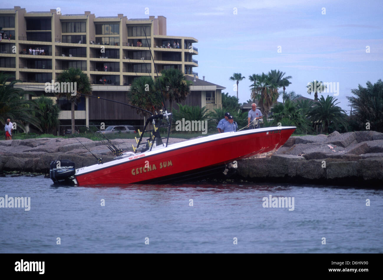 A wrecked fishing boat that ran aground on the jetties near Port