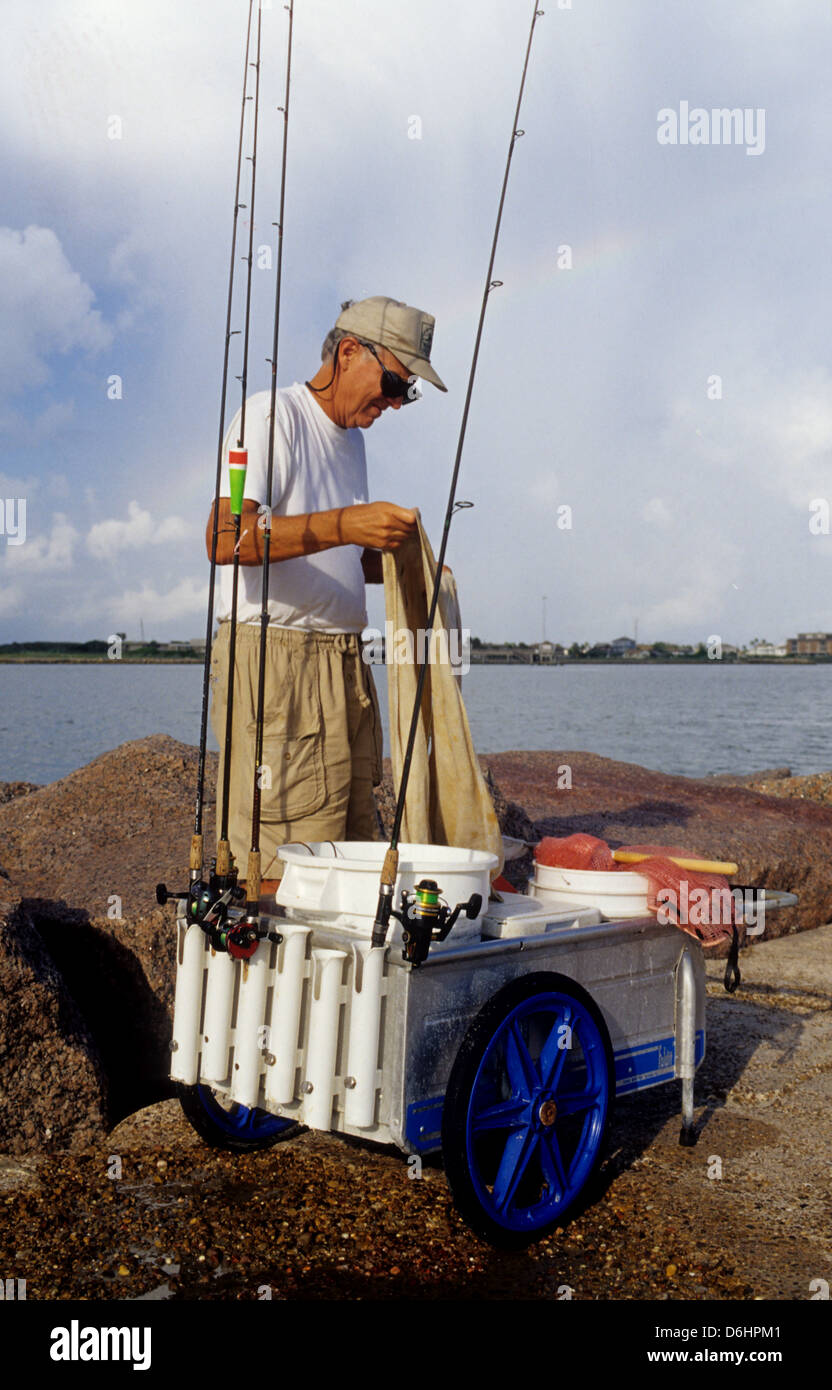 Fisherman loading his jetty fishing cart on the jetties at Port Aransas  Texas Stock Photo - Alamy