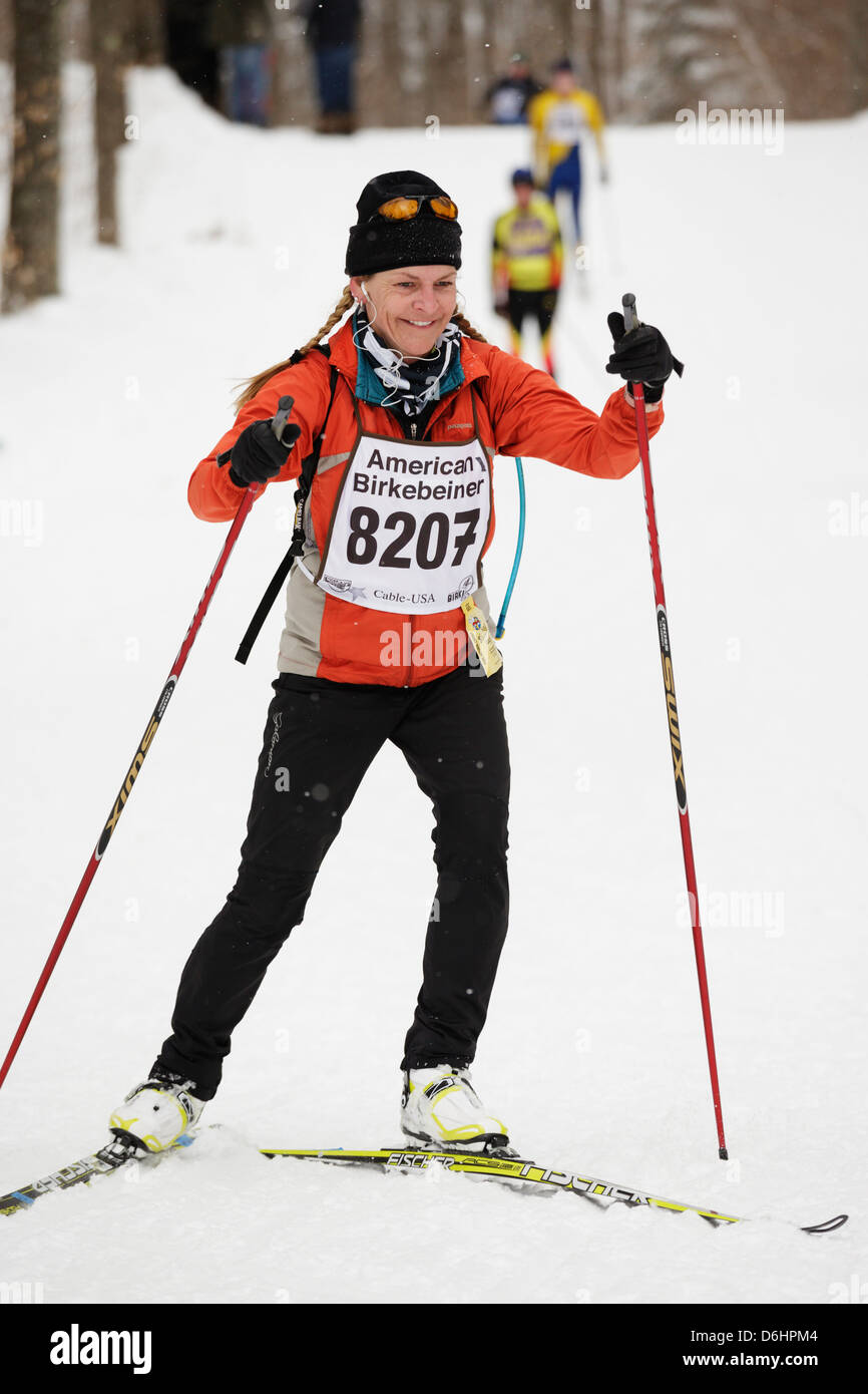 A woman on the trail between Cable and Hayward, Wisconsin skis in the
