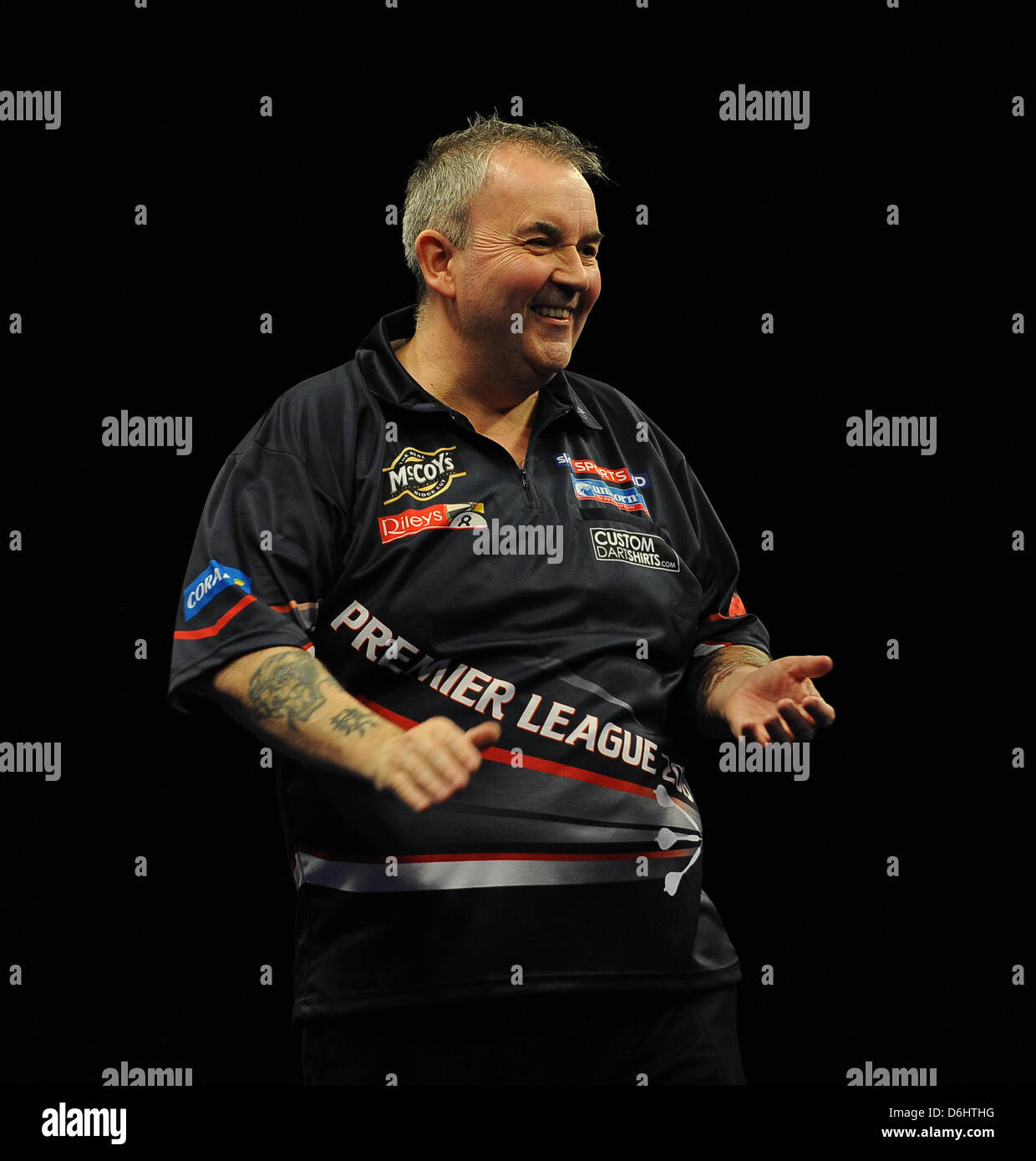 18.04.2013 Dublin, Ireland. Phil Taylor celebrates after winning his match against Raymond van Barneveld in round Eleven of the Premier League Darts from The O2 in Dublin. Stock Photo