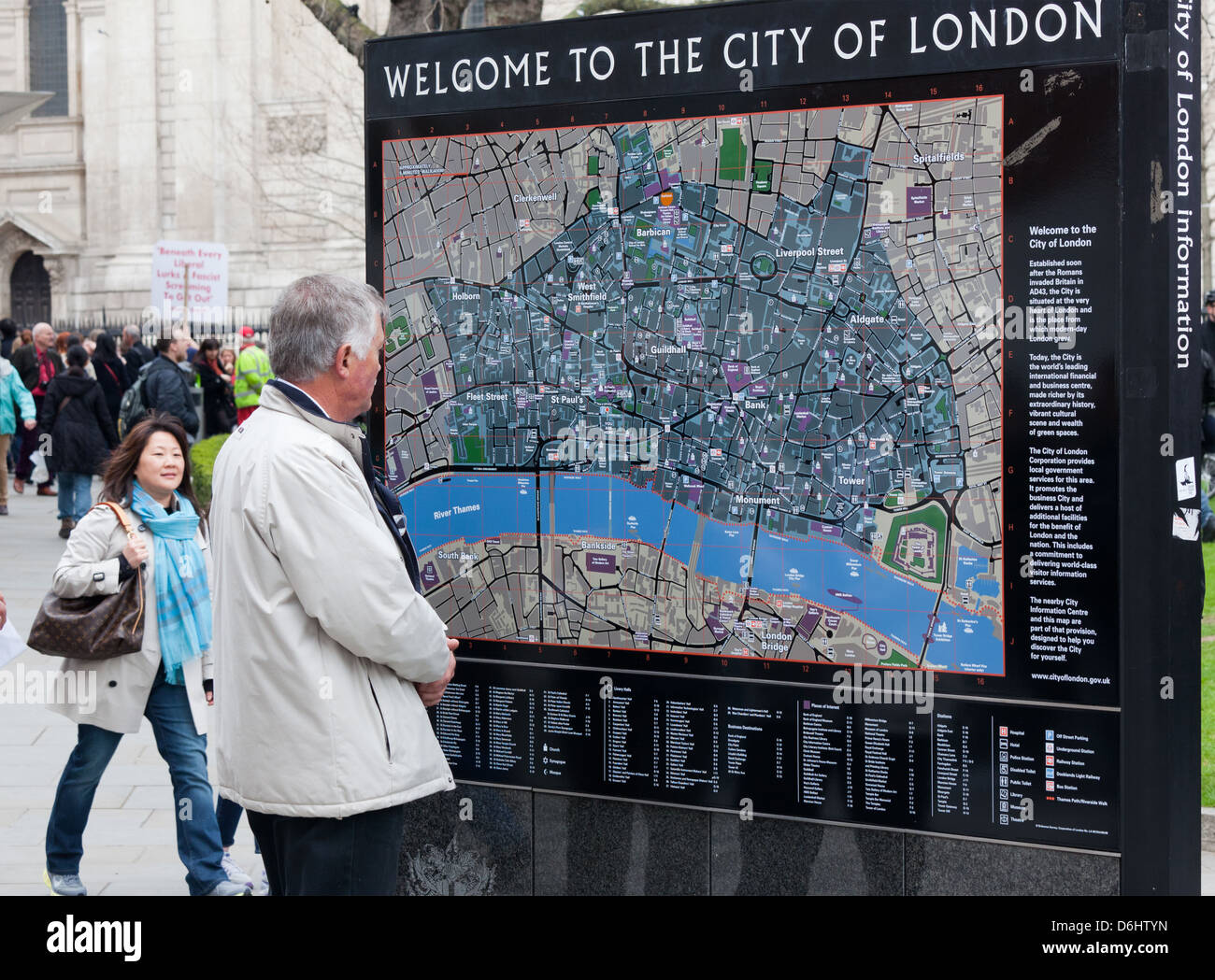 Tourists Reading a Tourist Map London UK Stock Photo
