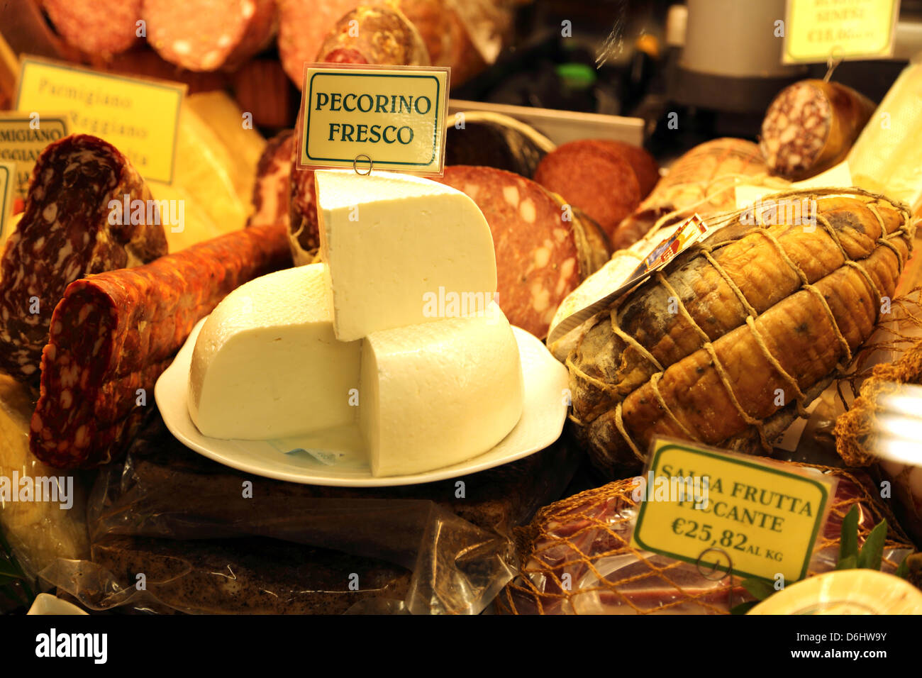 A selection of salami and cheese on display in San Lorenzo market in Florence Italy Stock Photo