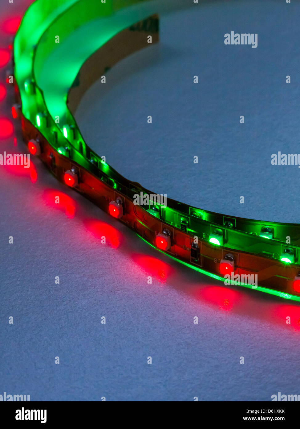 Close up of high intensity LED lighting strips illuminated with very narrow depth of field. Printed circuitry clearly seen. Stock Photo